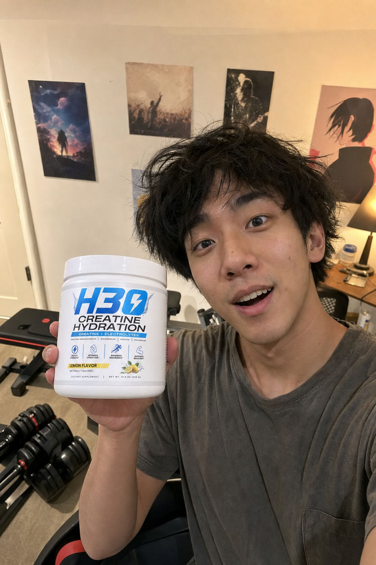 Young lifter holding up his first tub of H3O creatine hydration powder